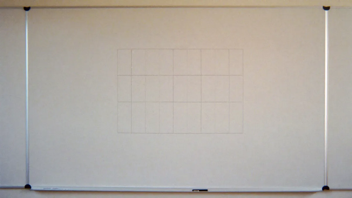 A blank whiteboard planning grid in a classroom